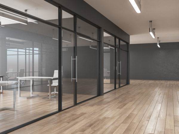 Clean office interior with glass, wooden floor, furniture, city view and daylight. 3D Rendering